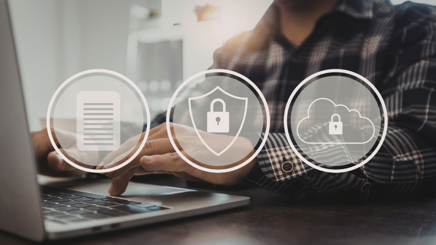 A person typing on a laptop with three logos on top of the image: a document, a padlock on a shield, and a padlock on a cloud.