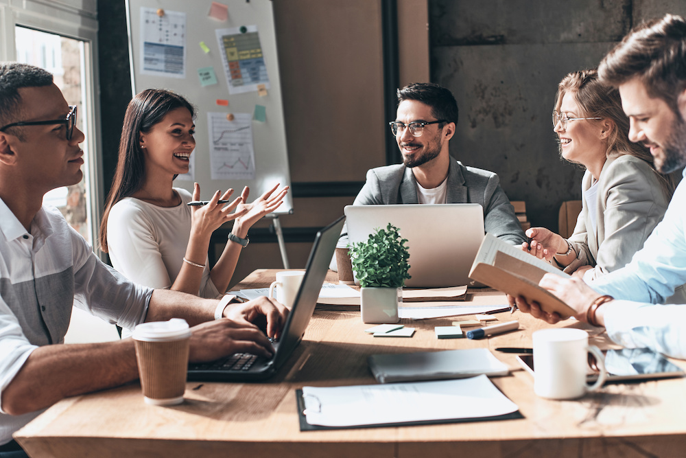 Working together. Group of young modern people in an onboarding meeting.