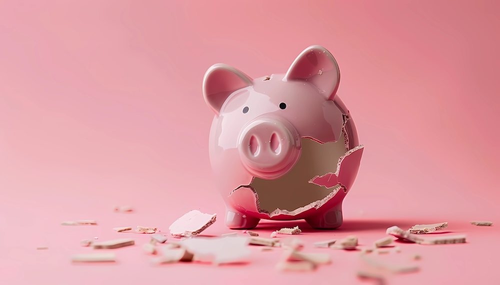 broken piggy bank. concept of cost of downtime.