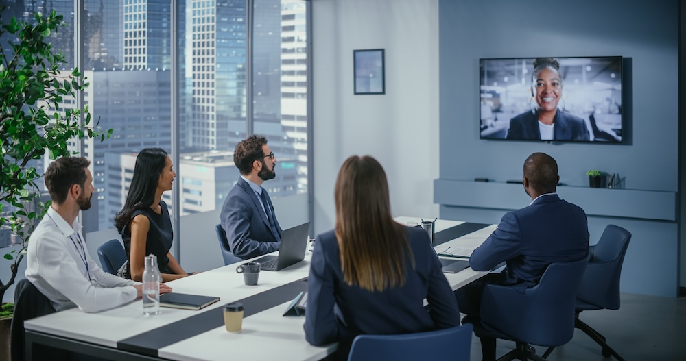 Video Conference Call in Office Meeting Room: vCISO Talks with team