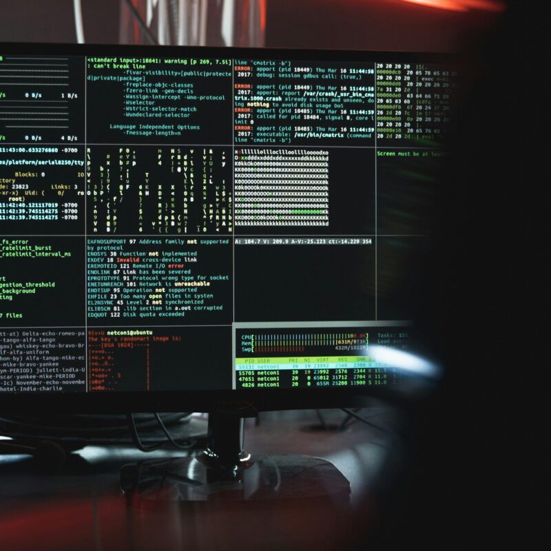 A cybersecurity or programming environment is active on a screen filled with code and performance data.