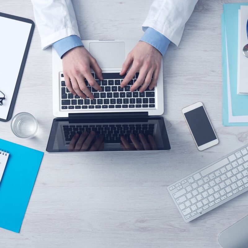 A healthcare provider uses secure digital tools, including laptops, tablets, and connected devices, to streamline patient care and manage medical data efficiently.