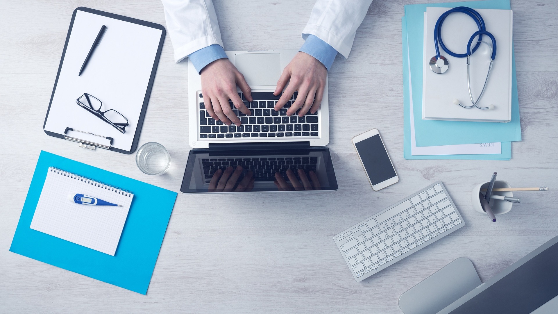 A healthcare provider uses secure digital tools, including laptops, tablets, and connected devices, to streamline patient care and manage medical data efficiently.