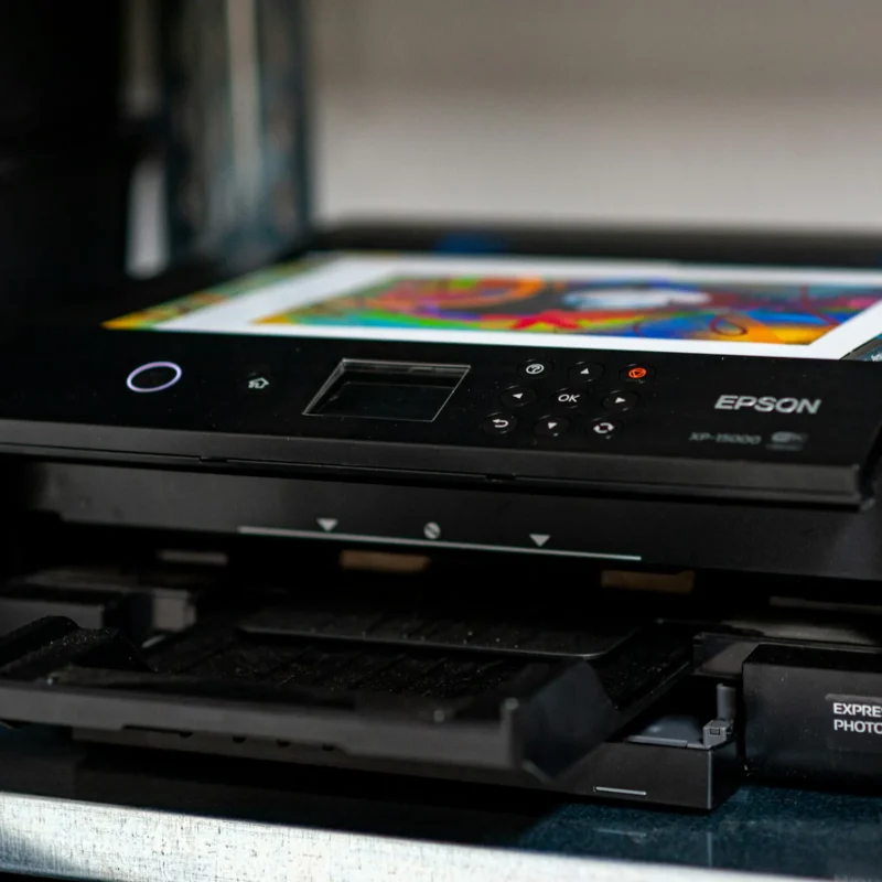 A printer sits idle, illustrating common printer problems that can disrupt productivity during high-volume printing periods.