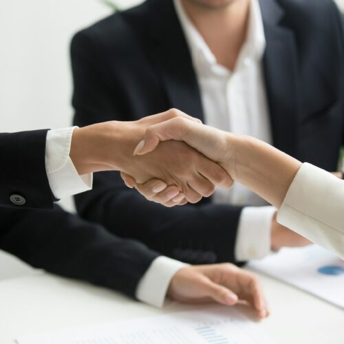 A vendor handshake during a business meeting.
