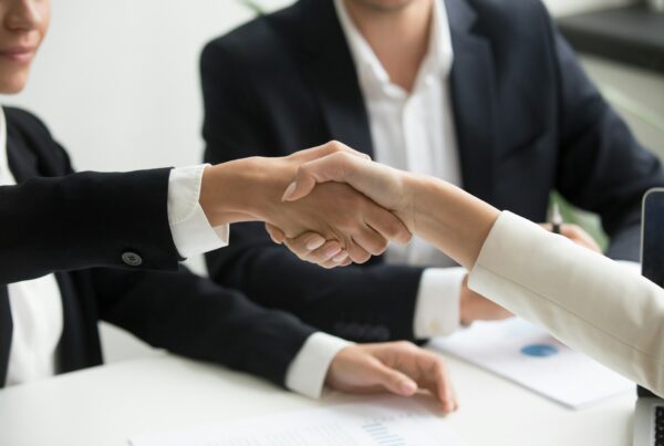 A vendor handshake during a business meeting.