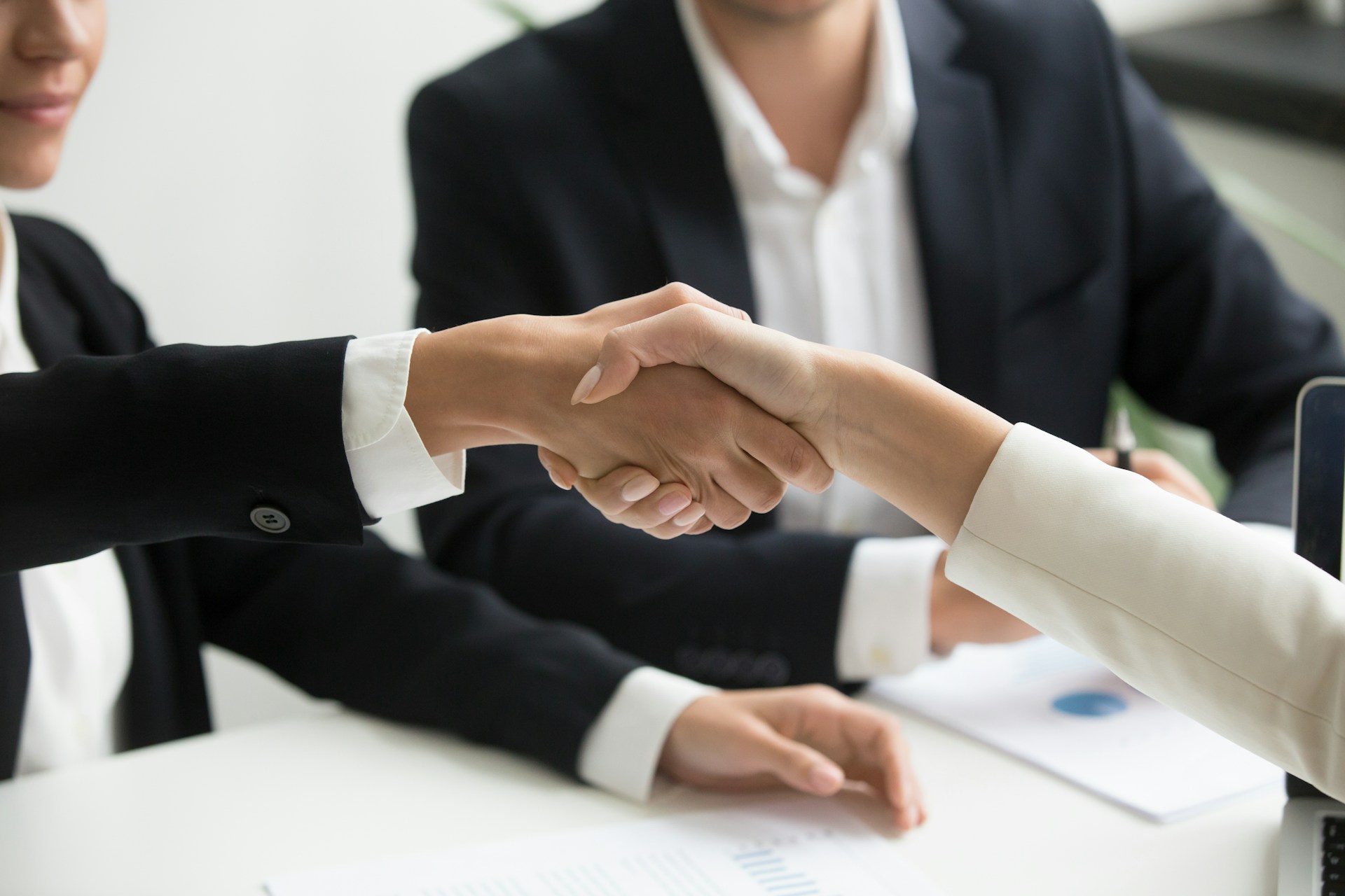 A vendor handshake during a business meeting.