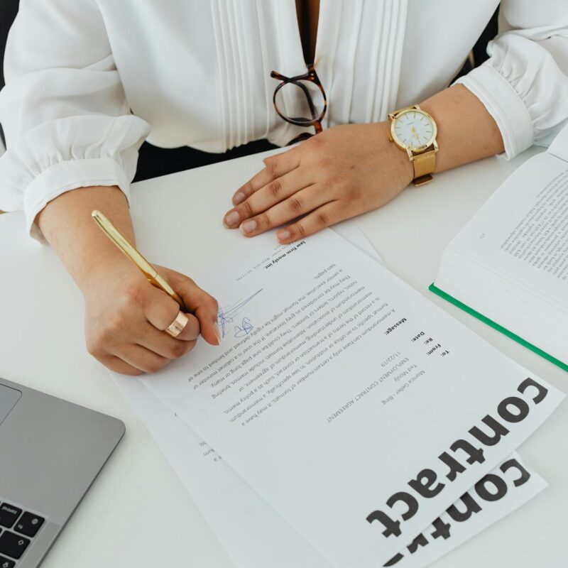 A person reviewing and signing a telecom contract