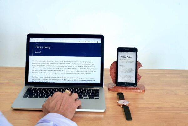 A person reviews a digital privacy policy on a laptop, demonstrating how AI workflow automation with Copilot accesses and organizes institutional data.