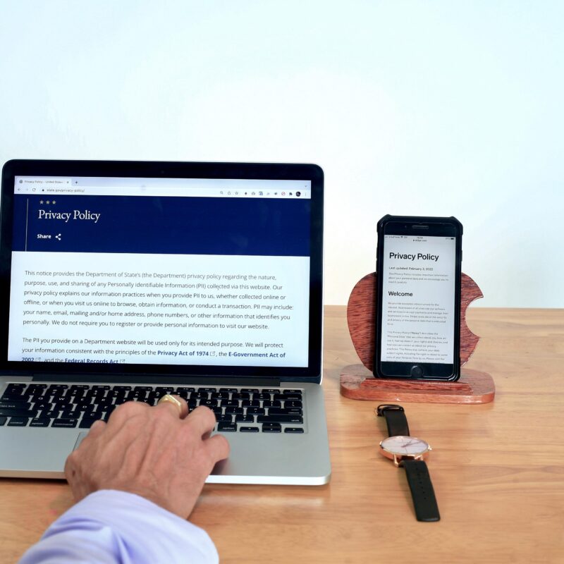 A person reviews a digital privacy policy on a laptop, demonstrating how AI workflow automation with Copilot accesses and organizes institutional data.
