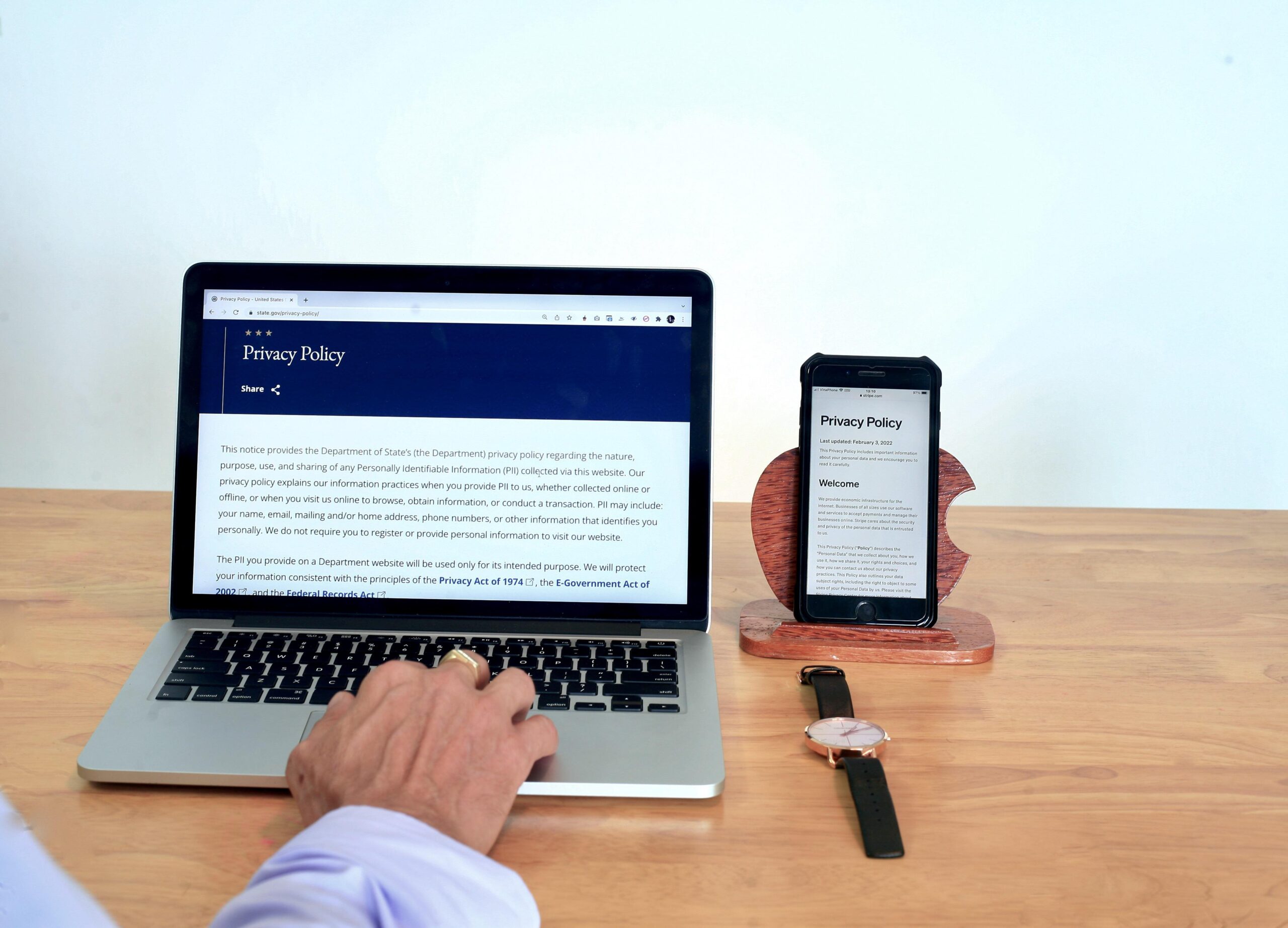 A person reviews a digital privacy policy on a laptop, demonstrating how AI workflow automation with Copilot accesses and organizes institutional data.