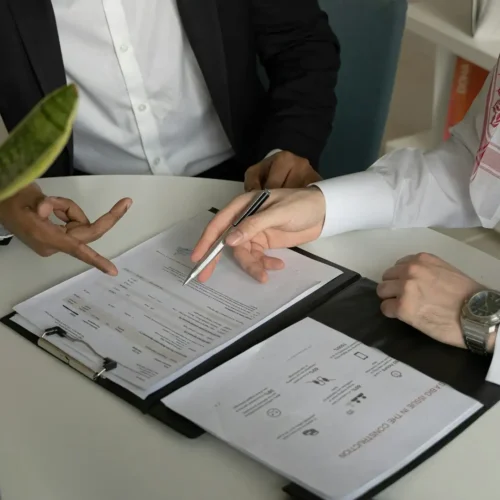 Two professionals review a technology roadmap template during a strategic planning meeting.