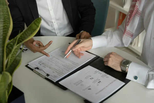 Two professionals review a technology roadmap template during a strategic planning meeting.