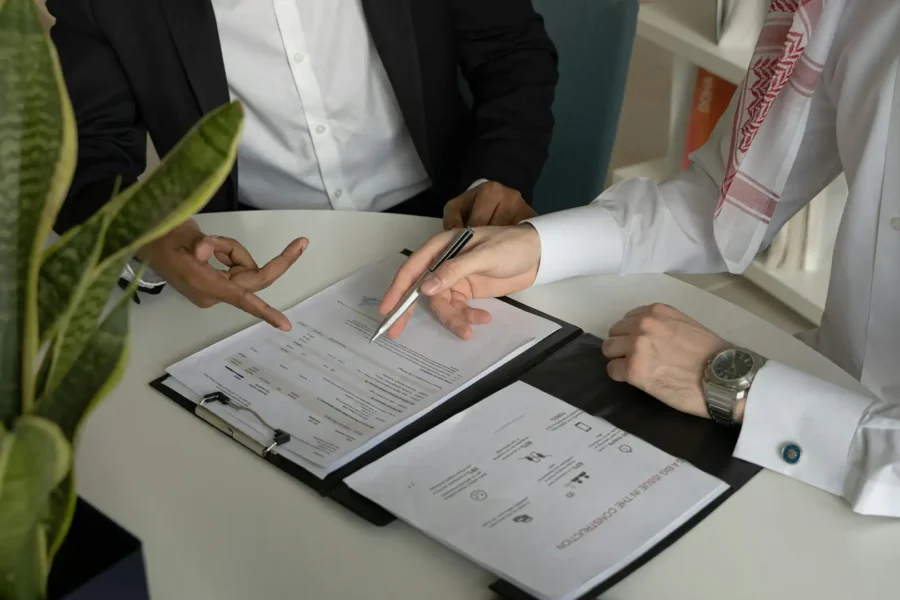 Two professionals review a technology roadmap template during a strategic planning meeting.