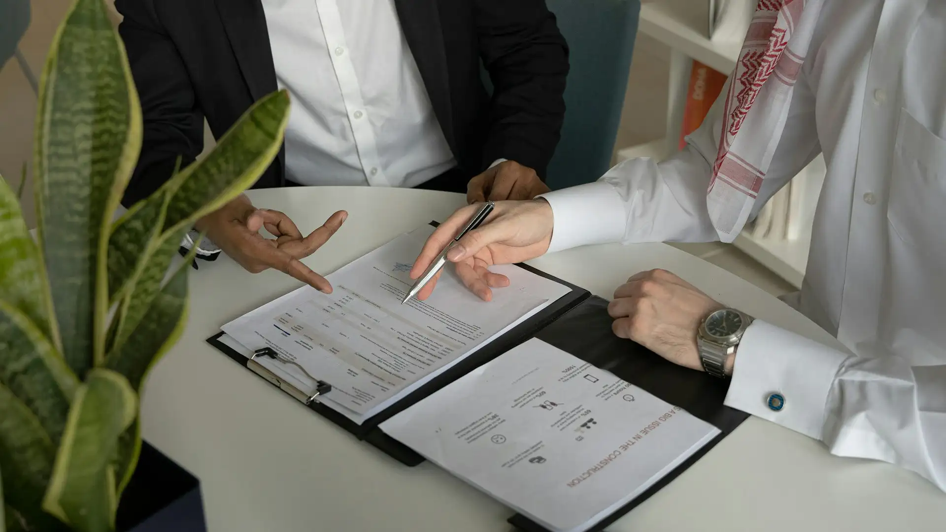 Two professionals review a technology roadmap template during a strategic planning meeting.