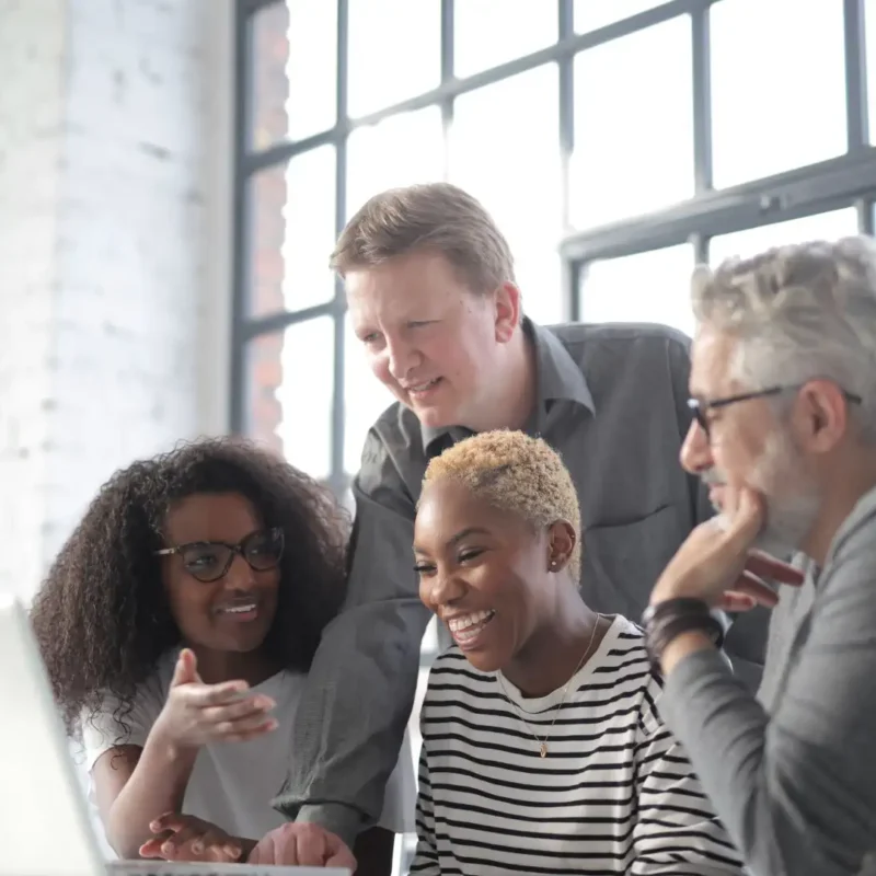 A team of colleagues collaborates with AI features in Microsoft 365
