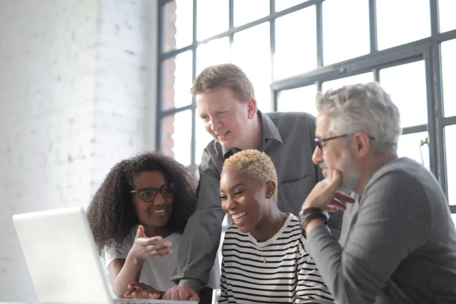 A team of colleagues collaborates with AI features in Microsoft 365