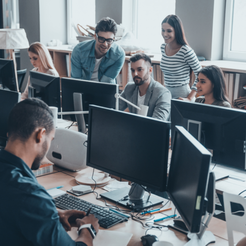 An office full of employees working on their computers.