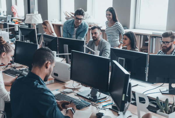 An office full of employees working on their computers.